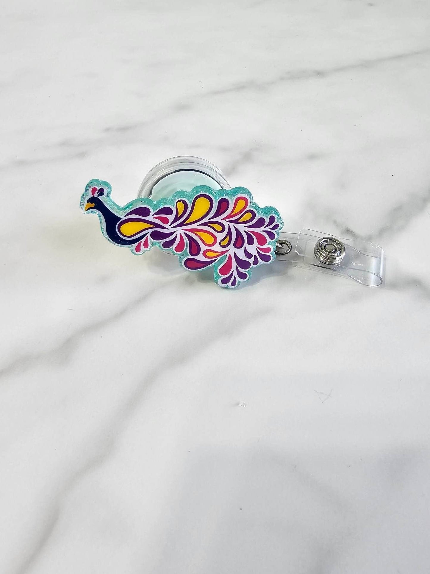 PEACOCK BADGE REEL