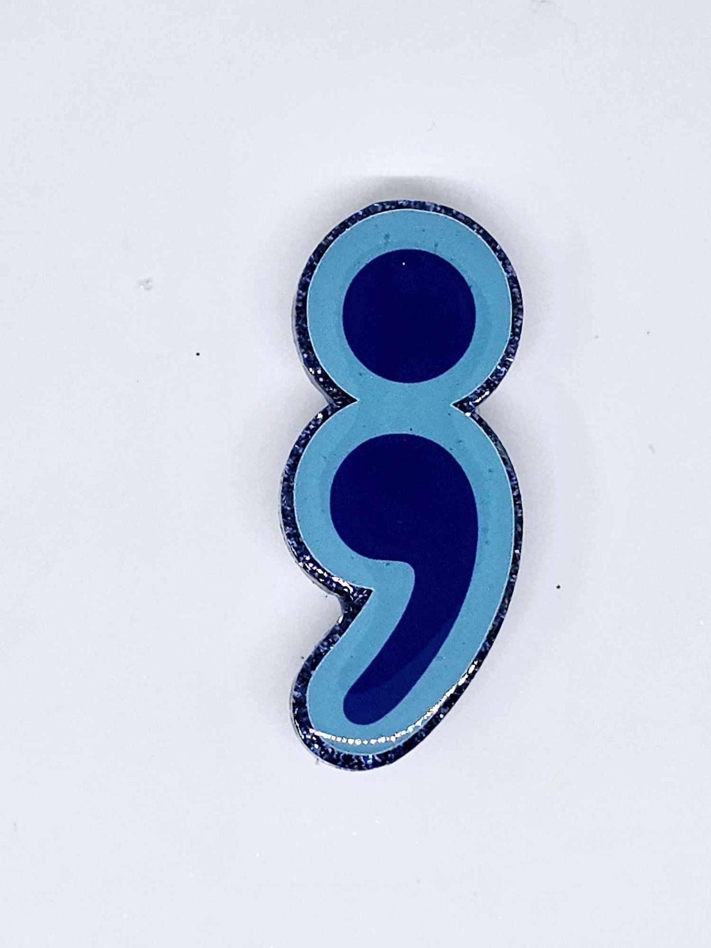 SEMICOLON BADGE REEL