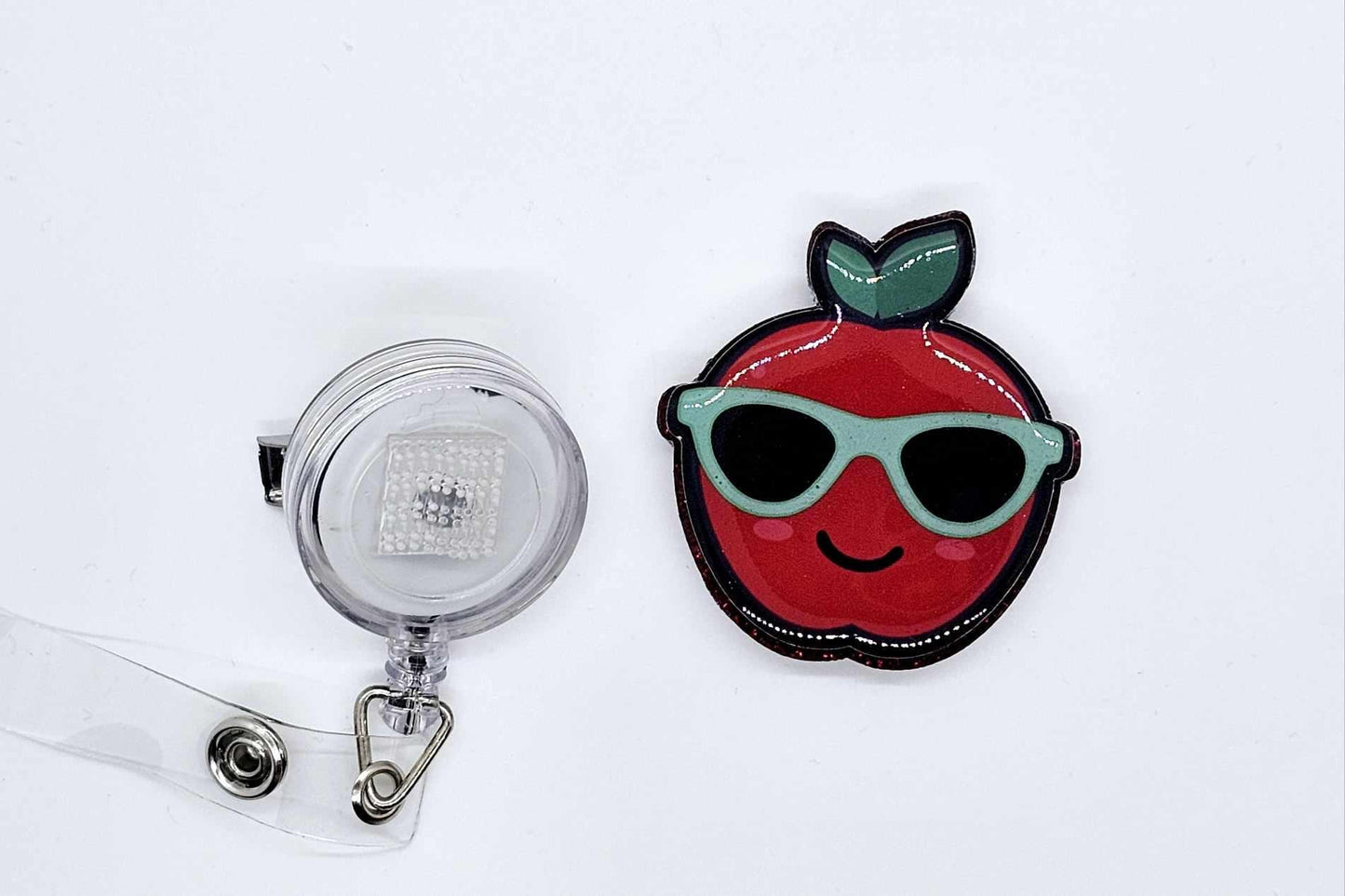 APPLE WITH SUNGLASSES BADGE REEL