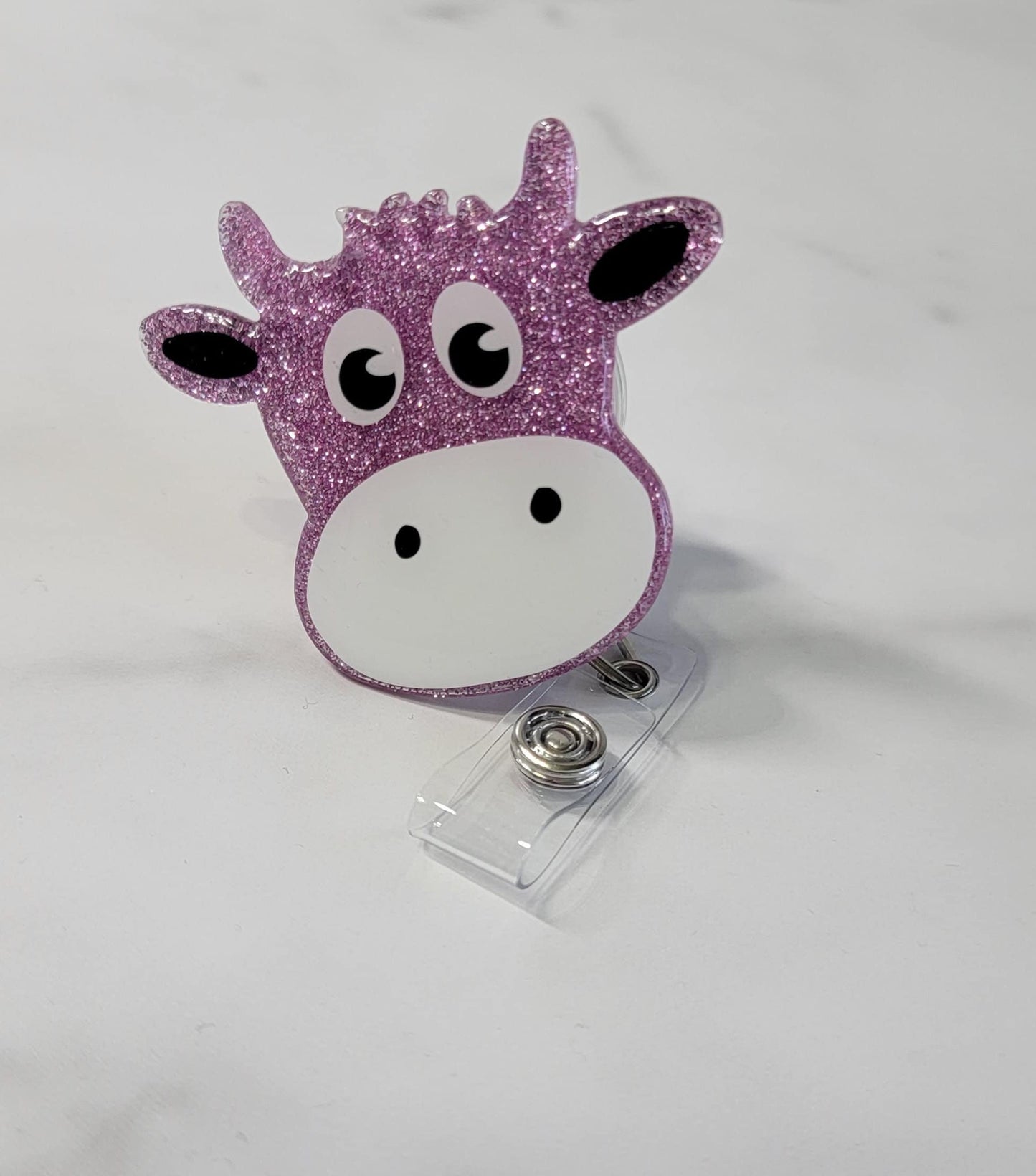 COW BADGE REEL