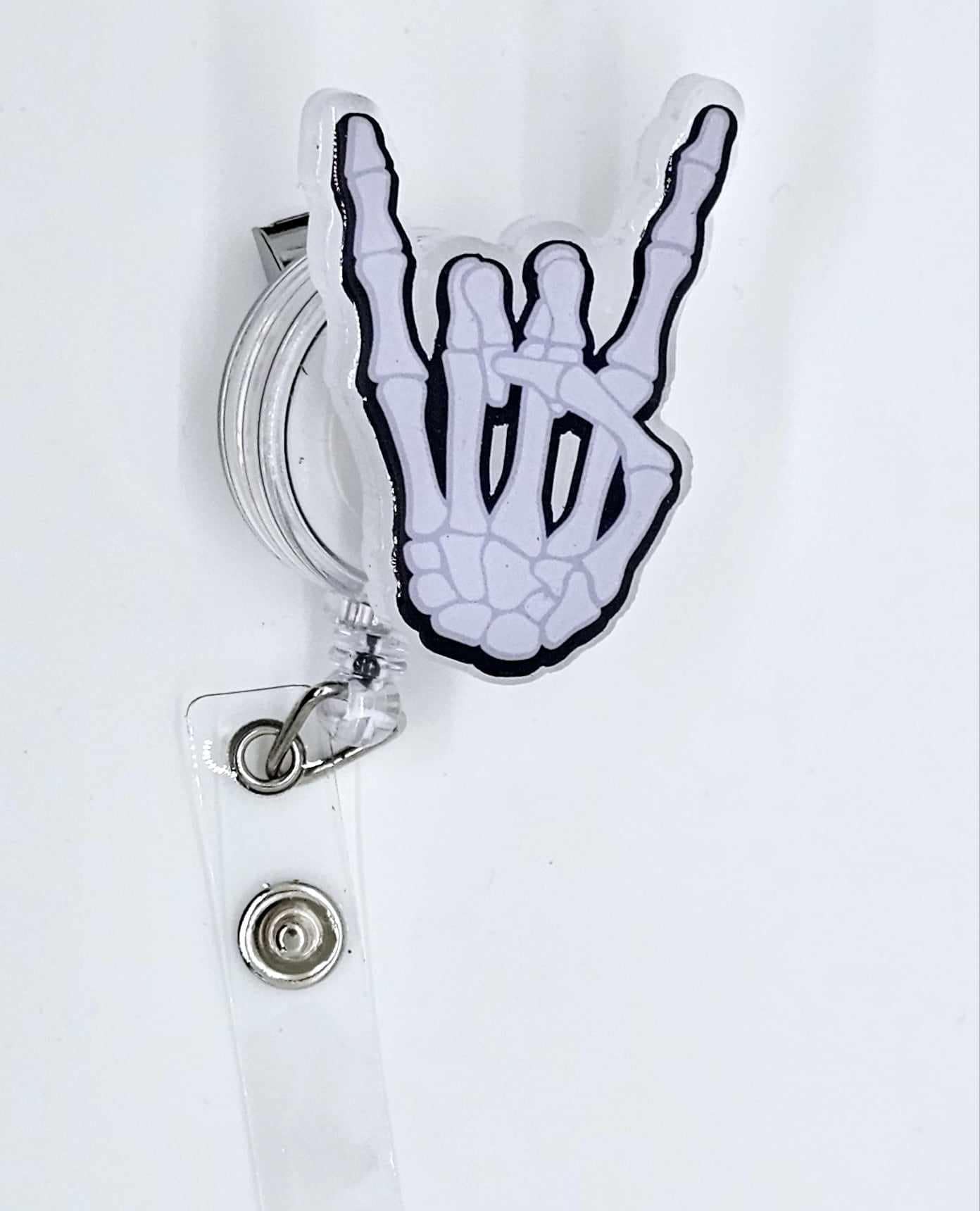 ROCK ON SKELETON HAND BADGE REEL