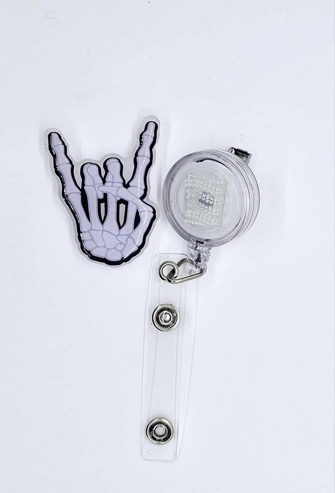ROCK ON SKELETON HAND BADGE REEL