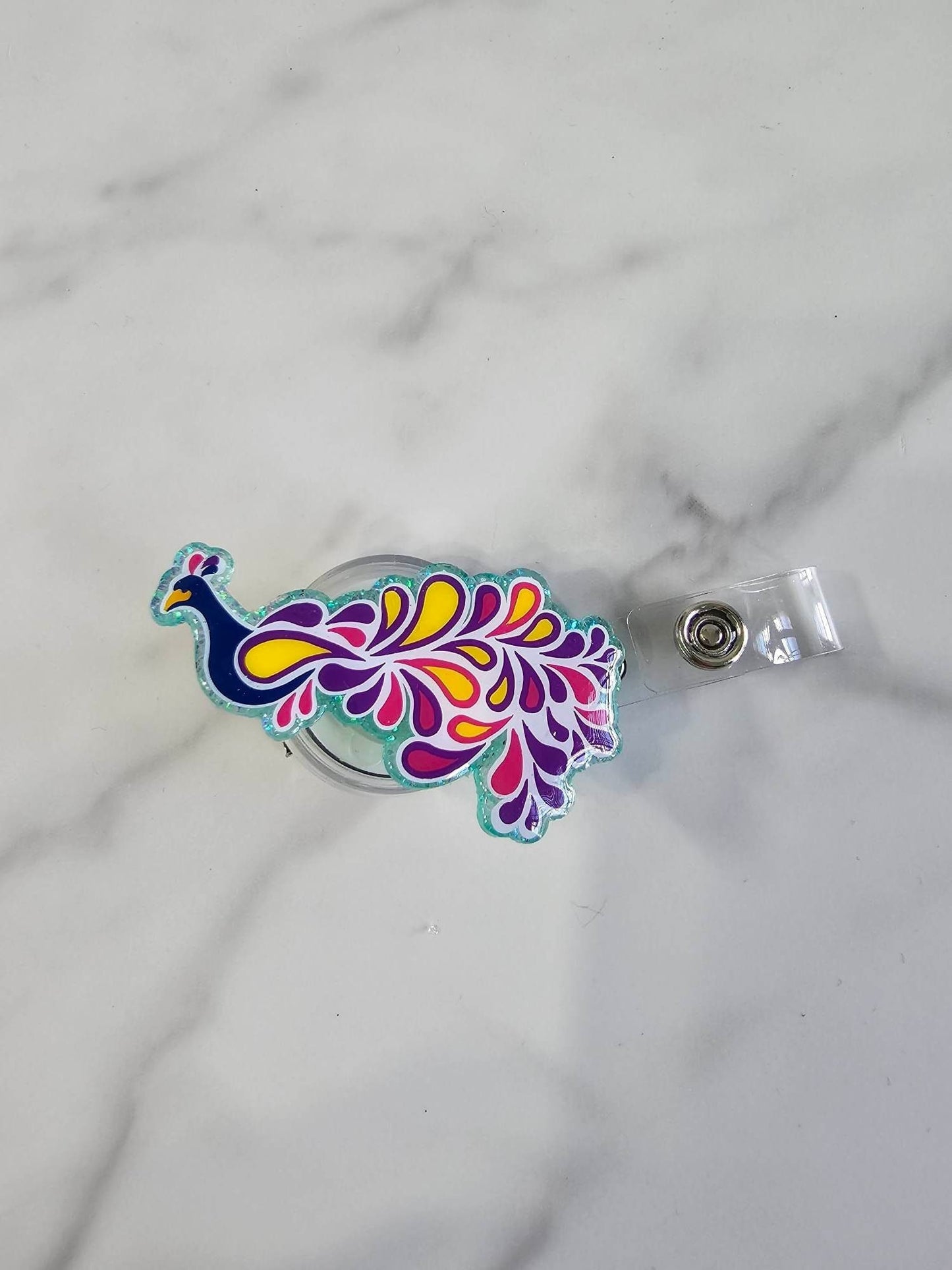 PEACOCK BADGE REEL