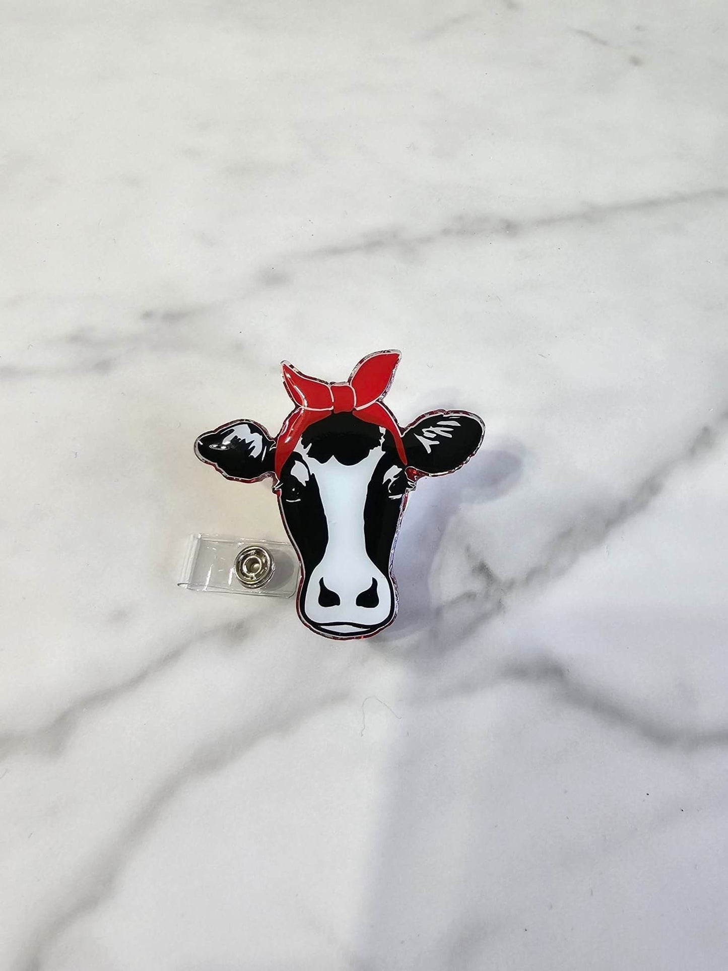 COW WITH BANDANA BADGE REEL