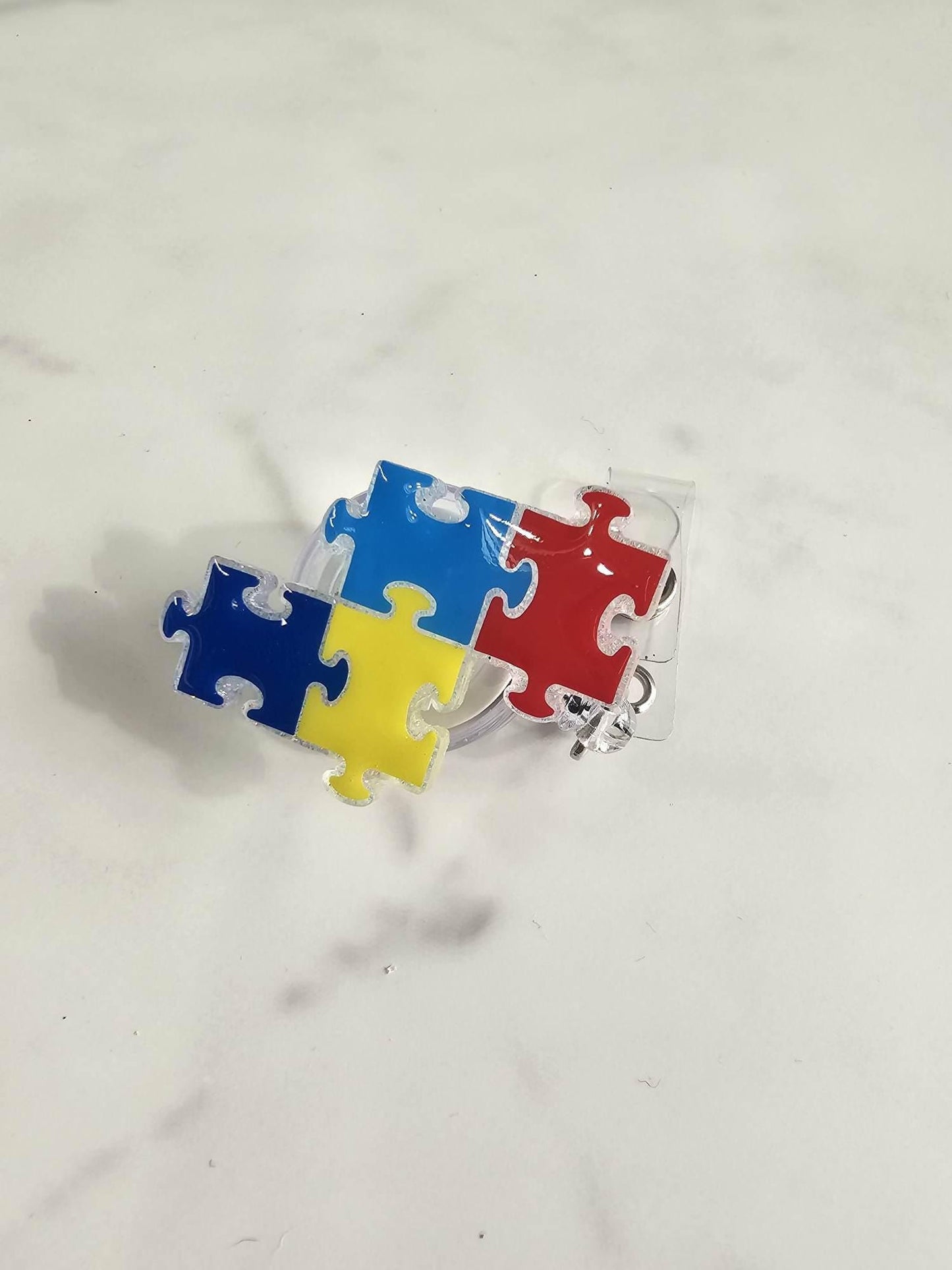 PUZZLE PIECES BADGE REEL