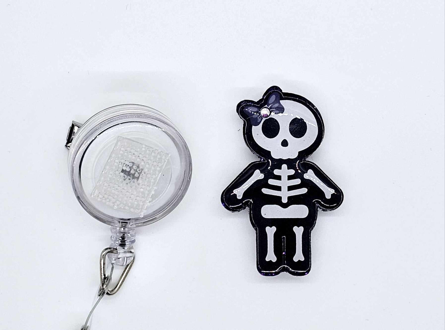 GIRL SKELETON BADGE REEL
