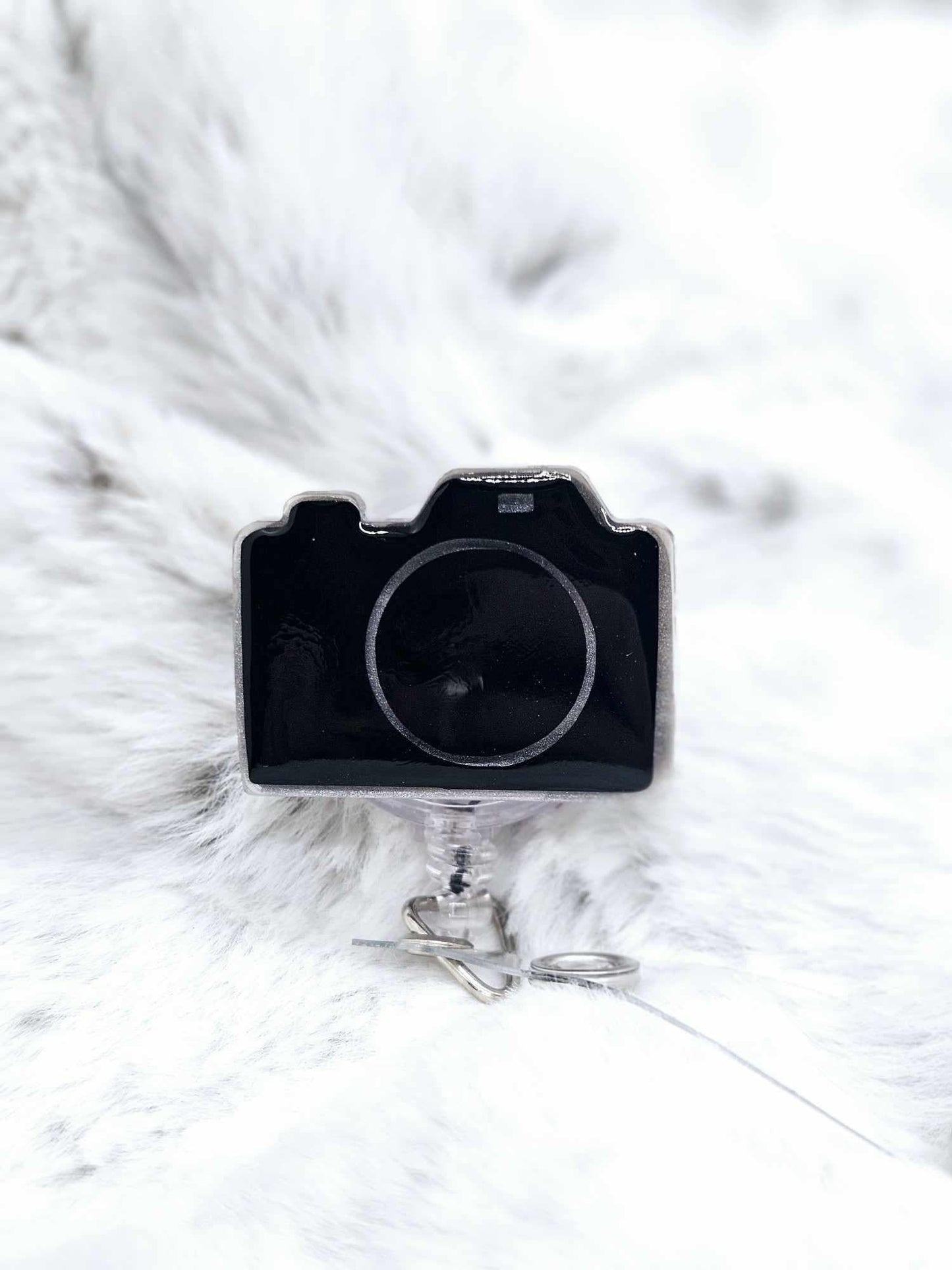 CAMERA BADGE REEL