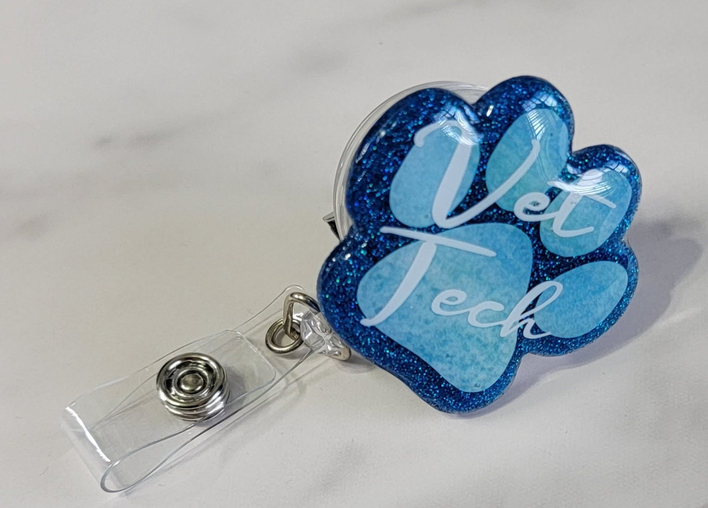 PAW PRINT BADGE REEL