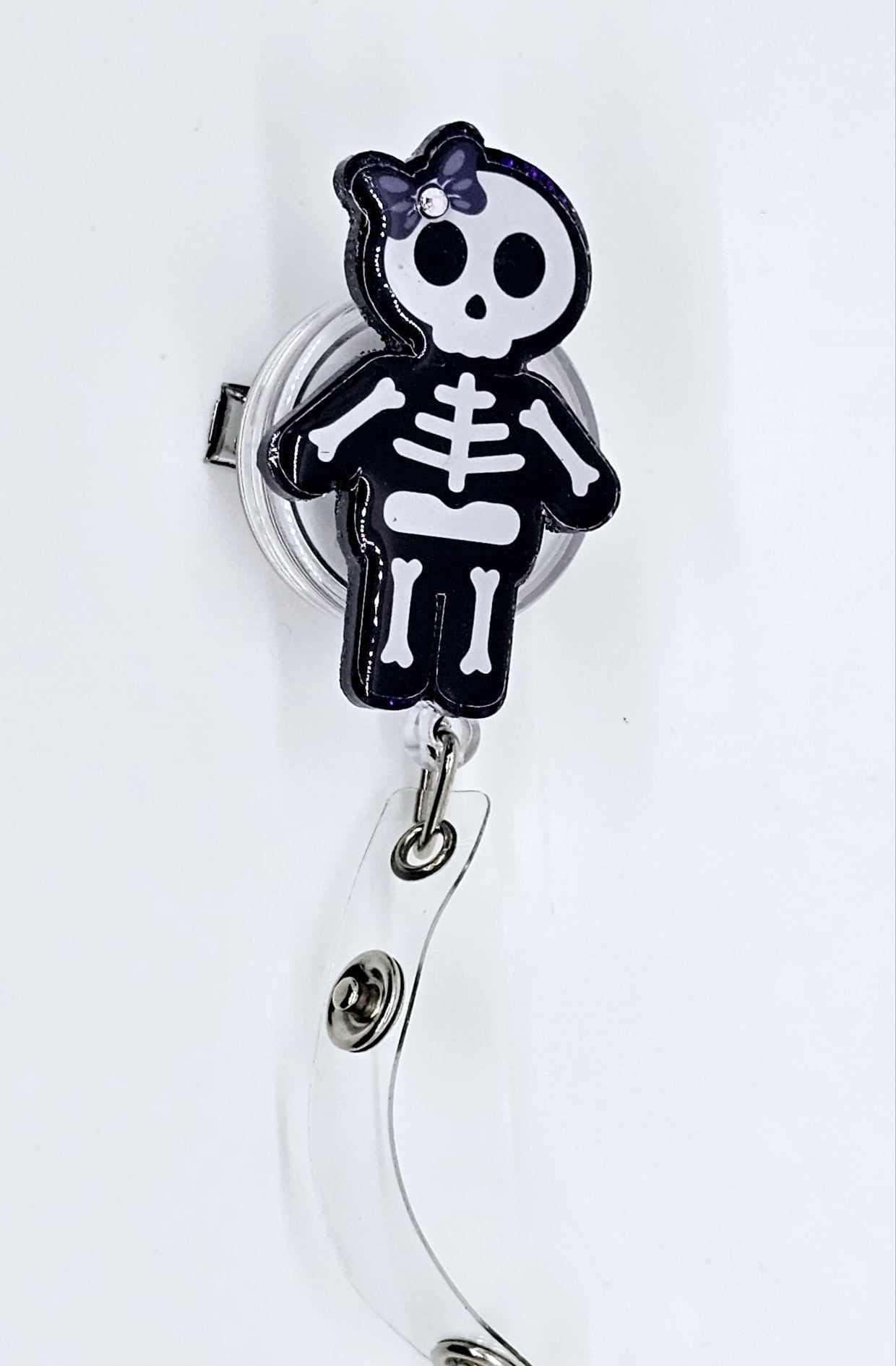 GIRL SKELETON BADGE REEL