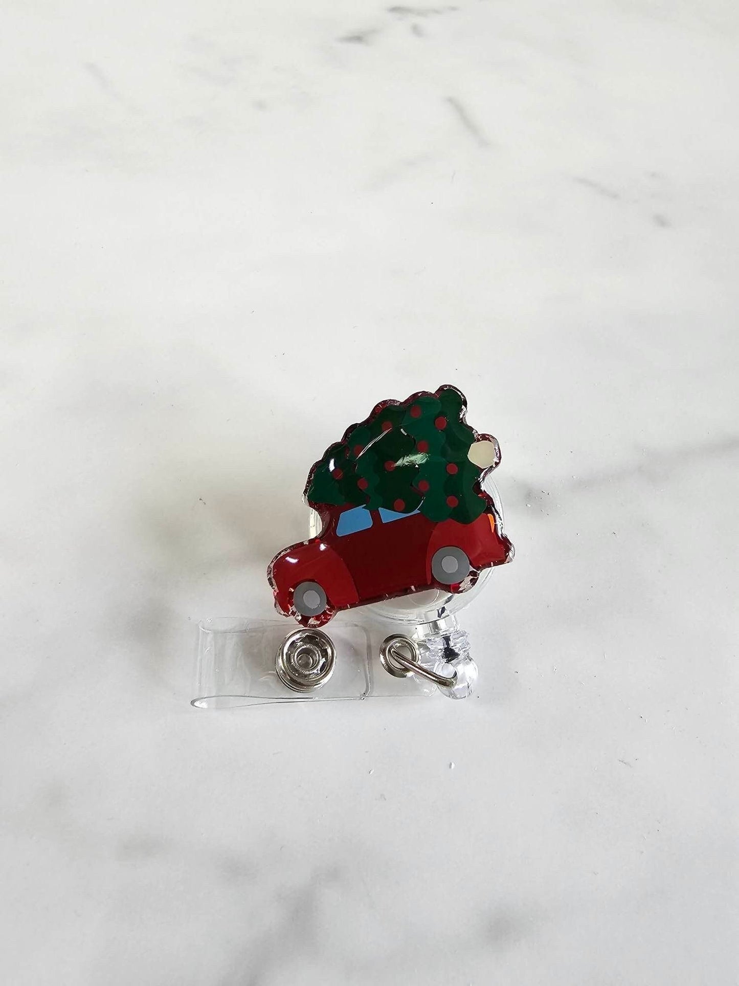 RED CAR WITH CHRISTMAS TREE BADGE REEL