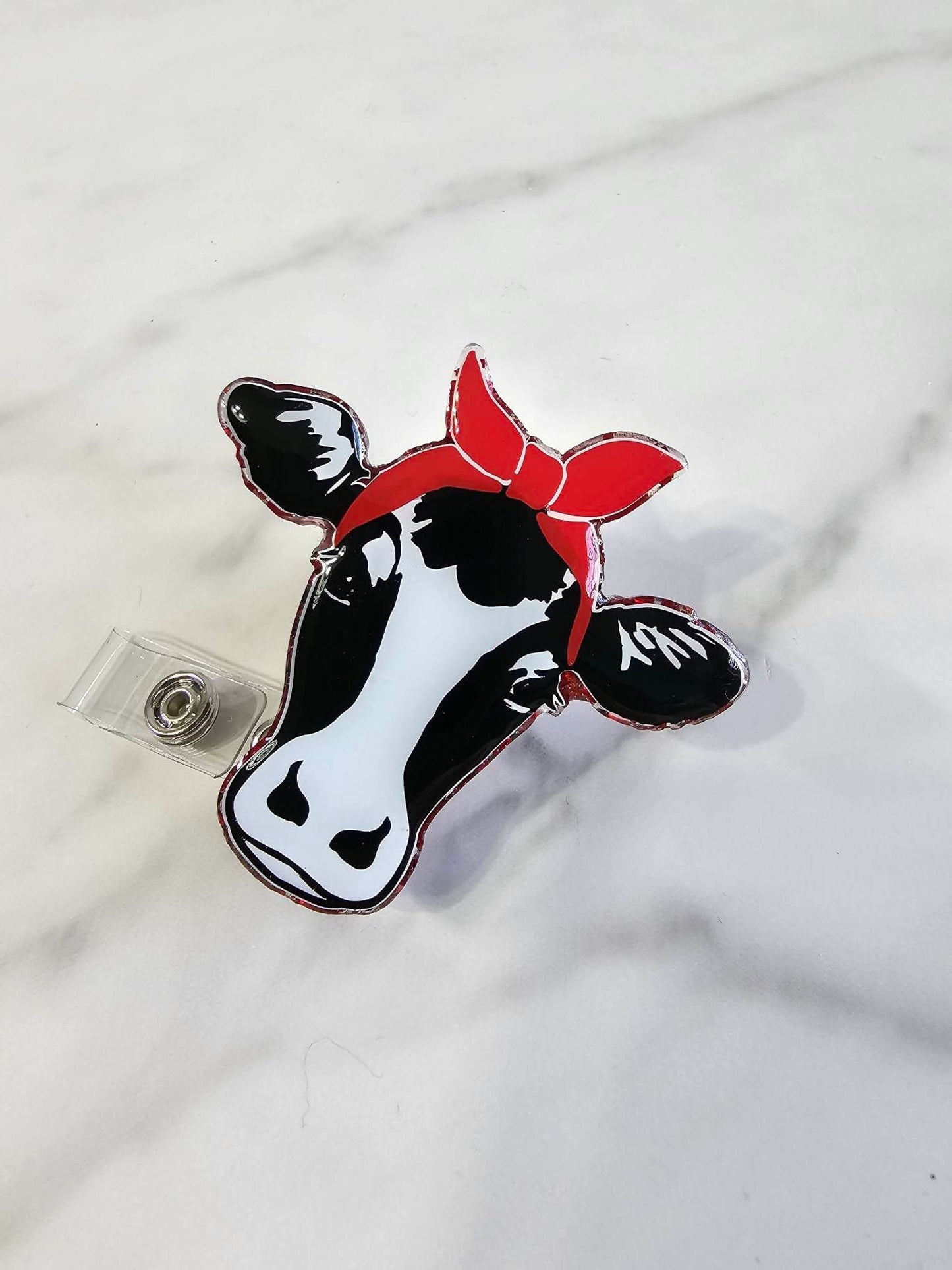 COW WITH BANDANA BADGE REEL