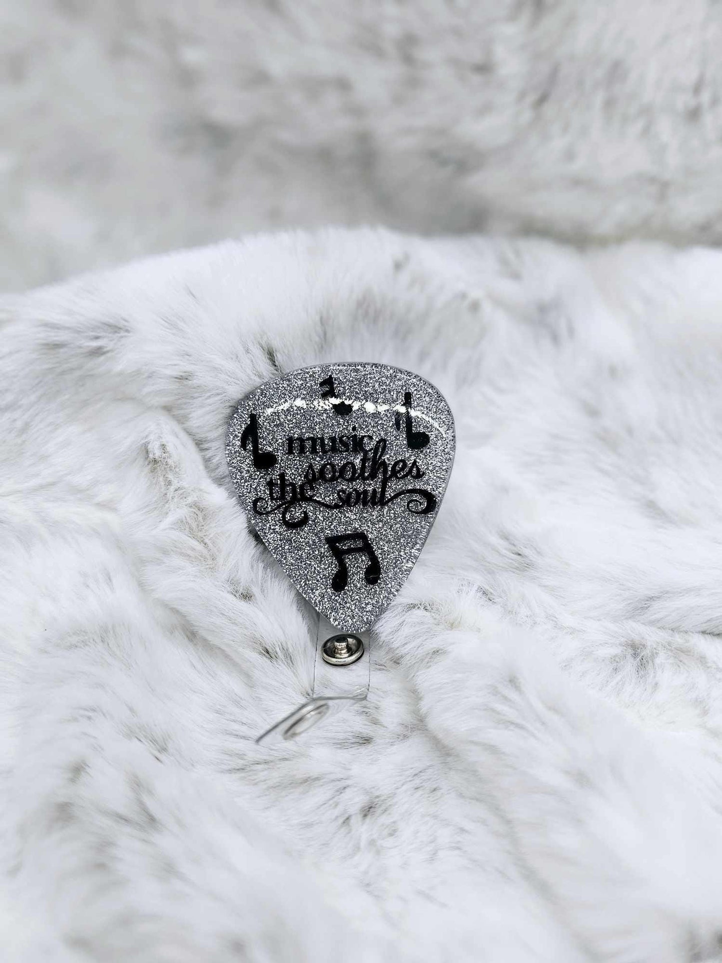 MUSIC SOOTHES THE SOUL GUITAR PICK BADGE REEL
