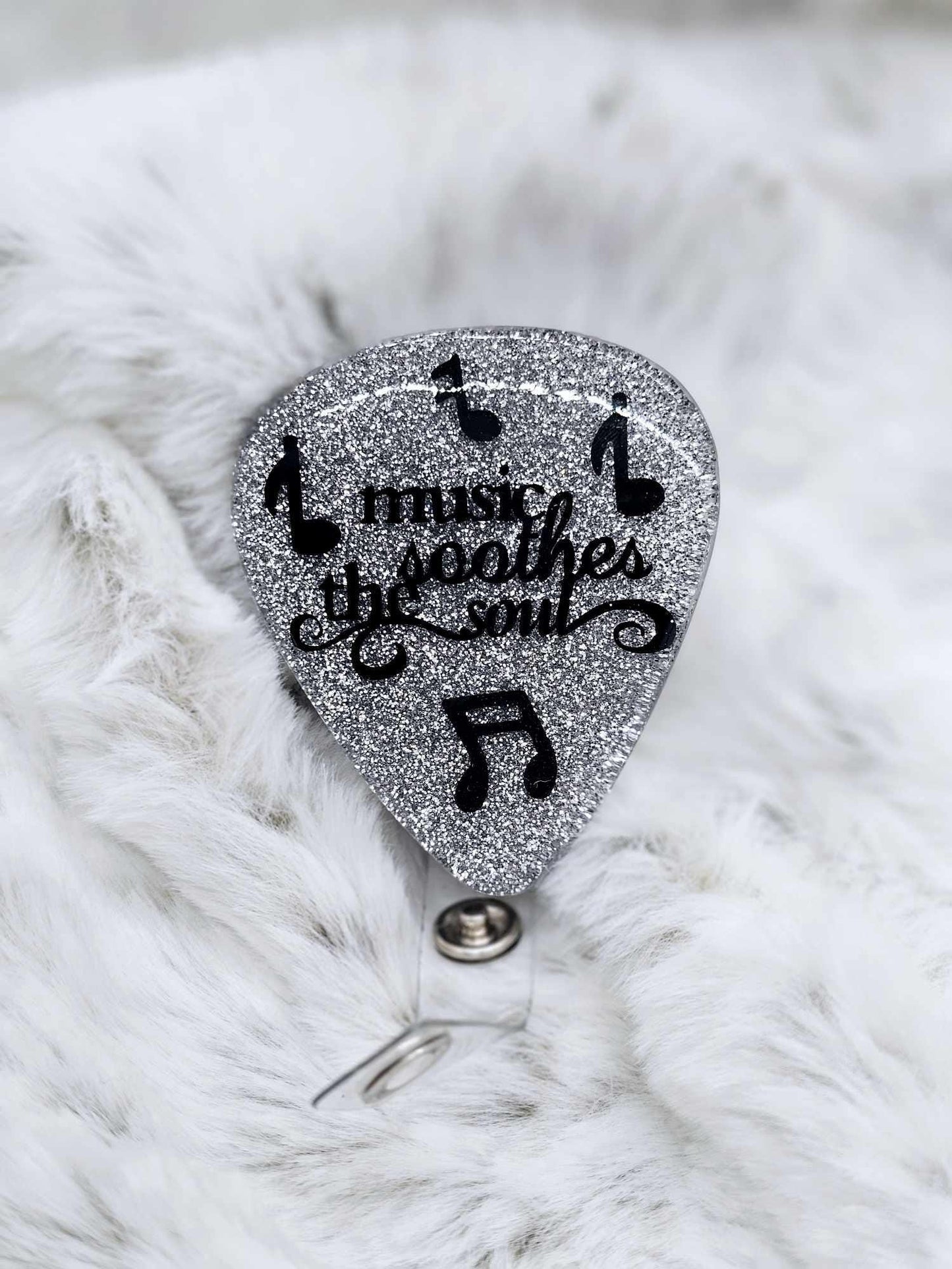 MUSIC SOOTHES THE SOUL GUITAR PICK BADGE REEL