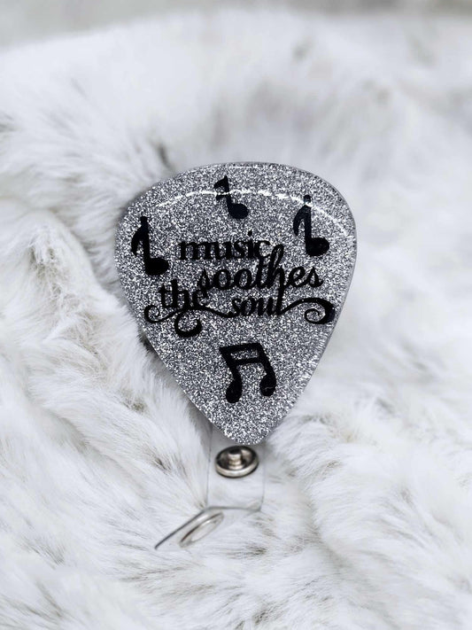 MUSIC SOOTHES THE SOUL GUITAR PICK BADGE REEL