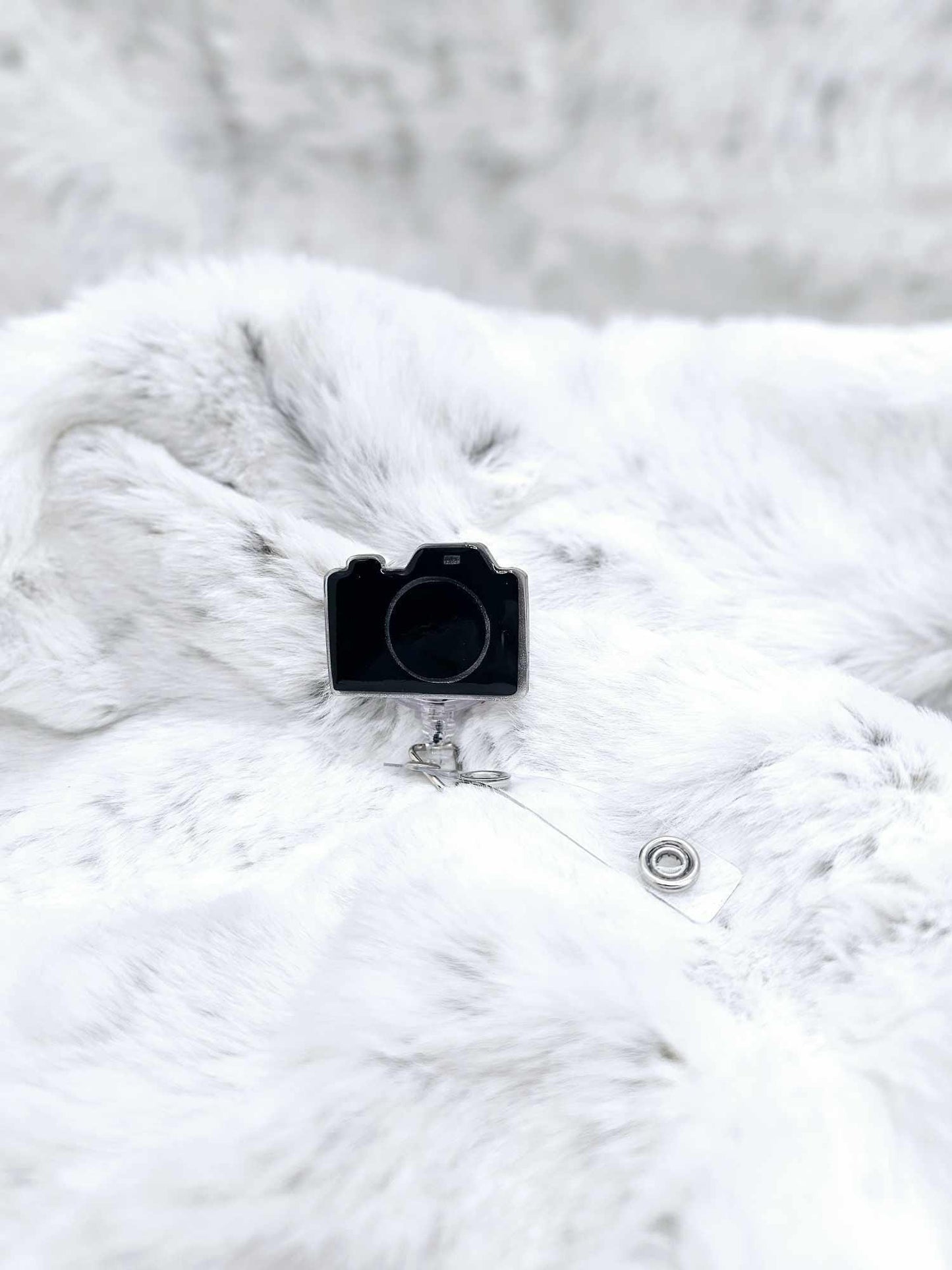 CAMERA BADGE REEL