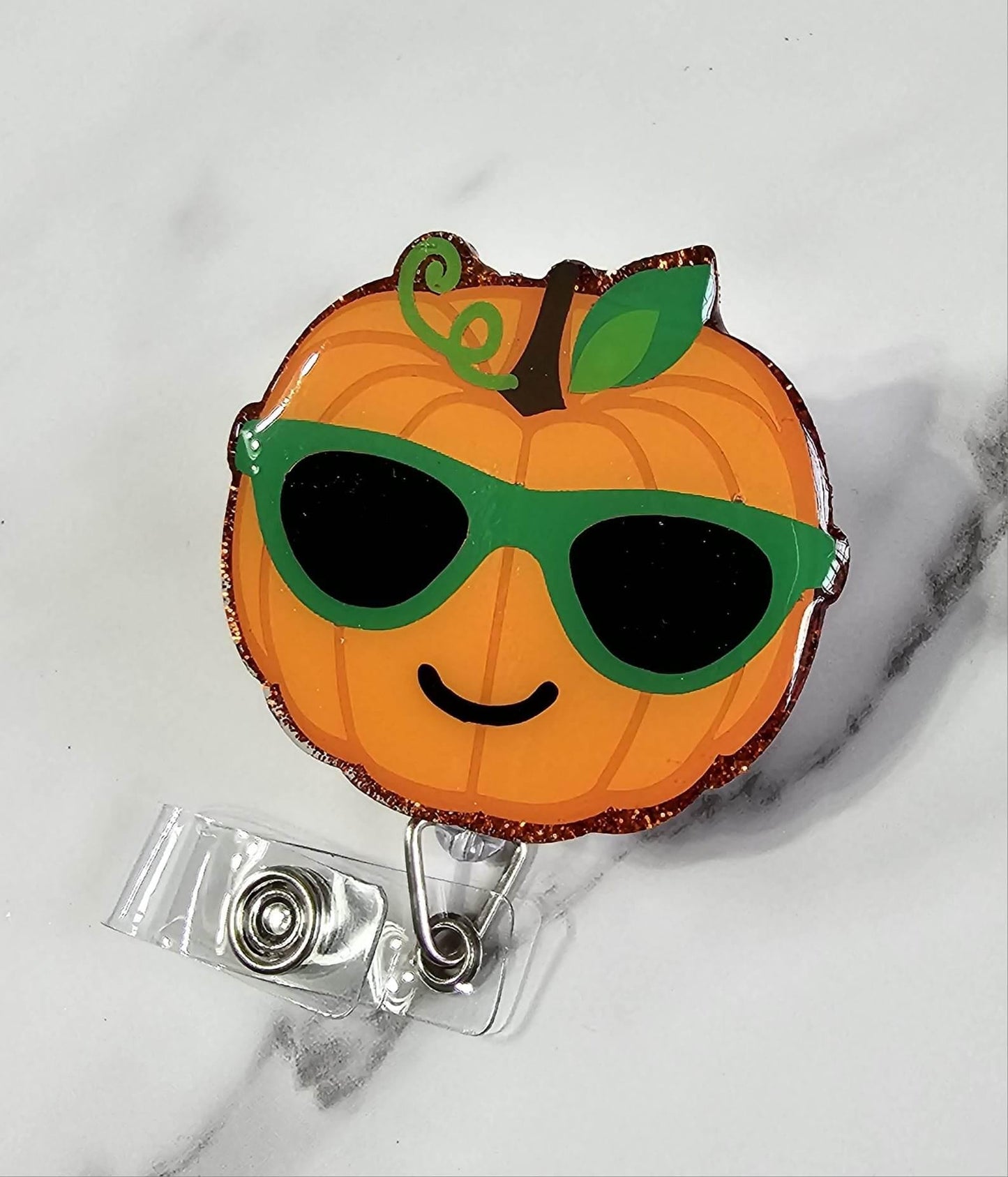 PUMPKIN WITH GLASSES BADGE REEL