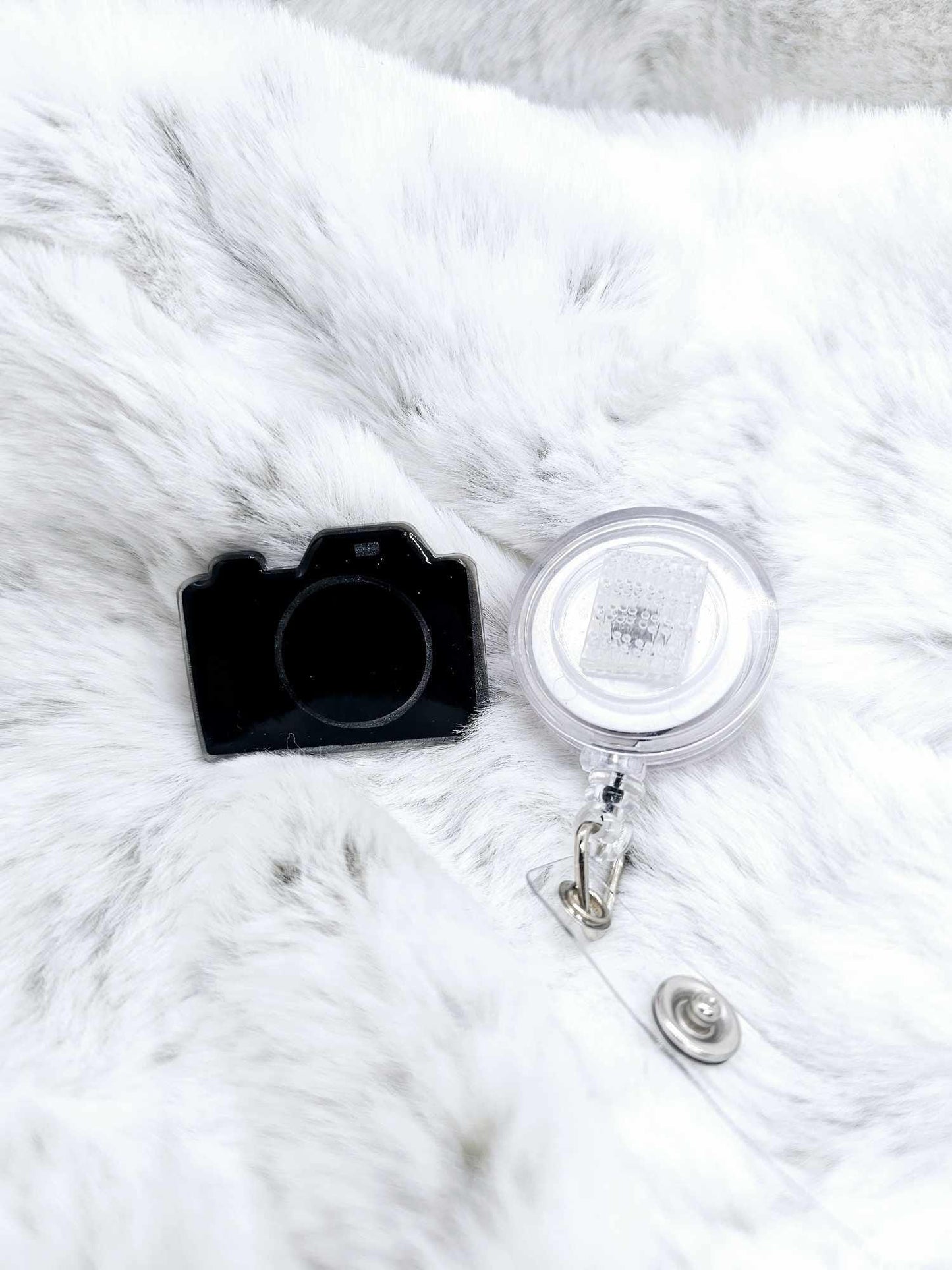 CAMERA BADGE REEL