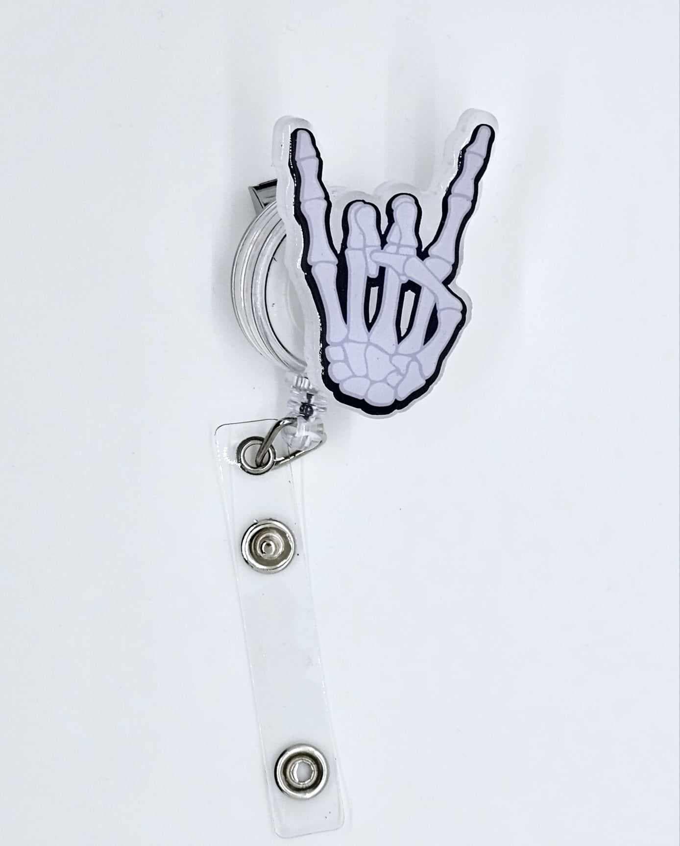 ROCK ON SKELETON HAND BADGE REEL